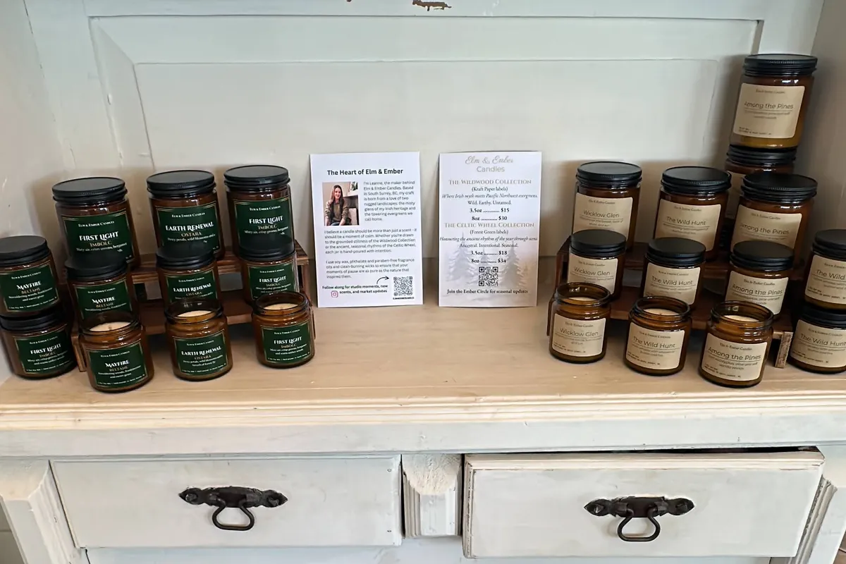 Elm & Ember candles on a white painted dresser at Pamper Me Day Spa